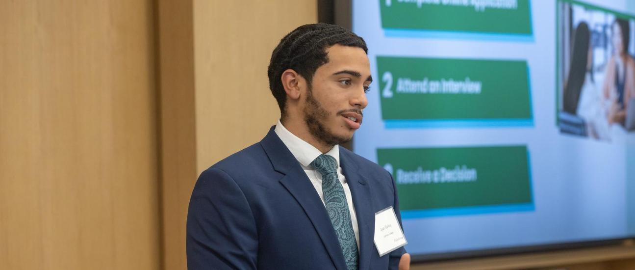 Man in suit giving a presentation