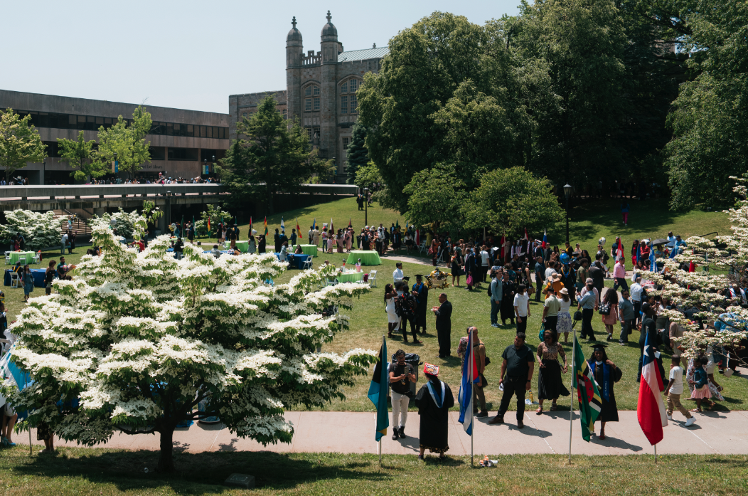 Photo of Lehman Campus quad with student graduates