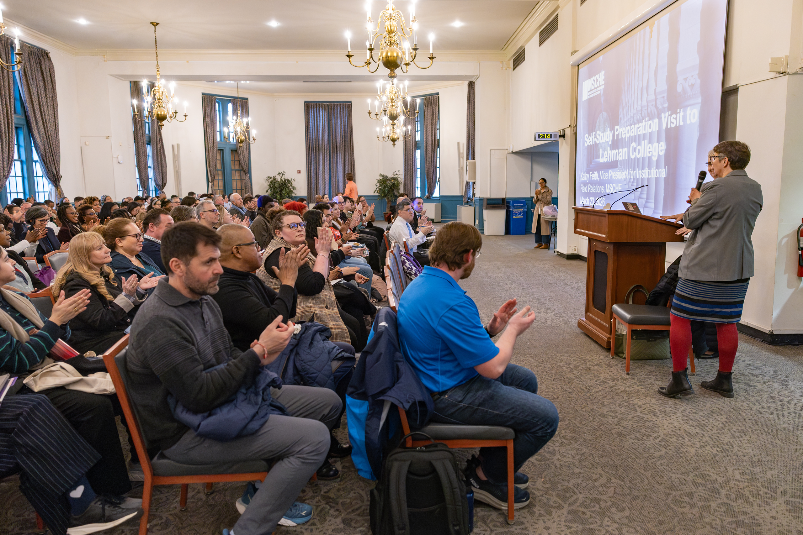 Attendees seating listening to a presentation
