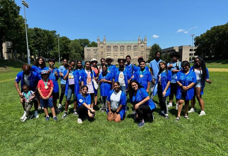 Young Students on the Athletic Field Posing as a Group