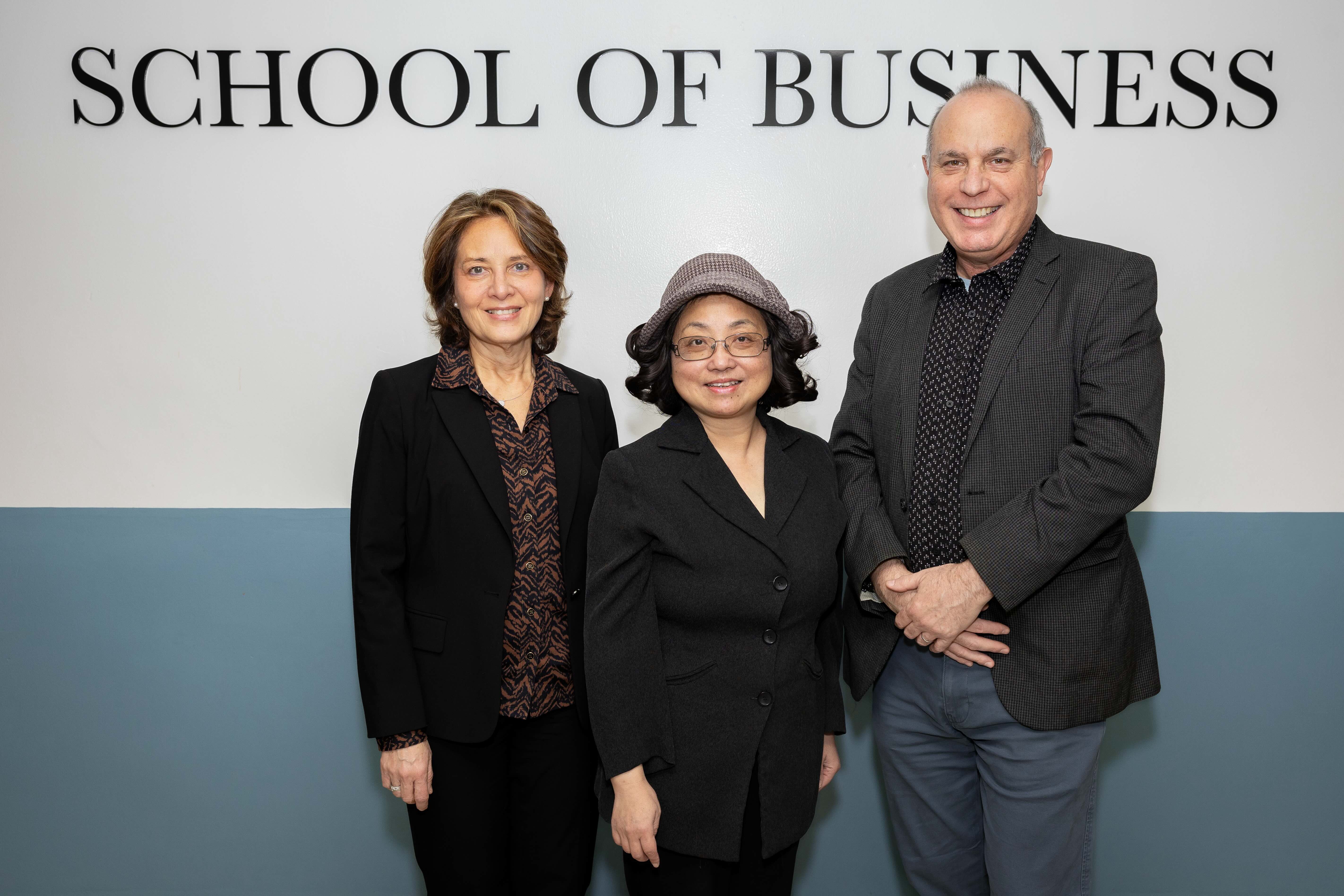 From left, Dene Hurley, dean of the School of Business, and faculty members Ning Chen and Andrew Gold, who were instrumental in bringing the collaboration to Lehman.