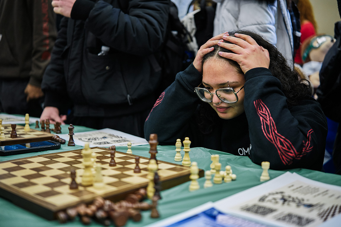 Helen Neundorff, president of the Earth, Environmental, and Geospatial Sciences Club played an intense game of chess at last week's Club Fair. (Photo by Marcus Beasley)