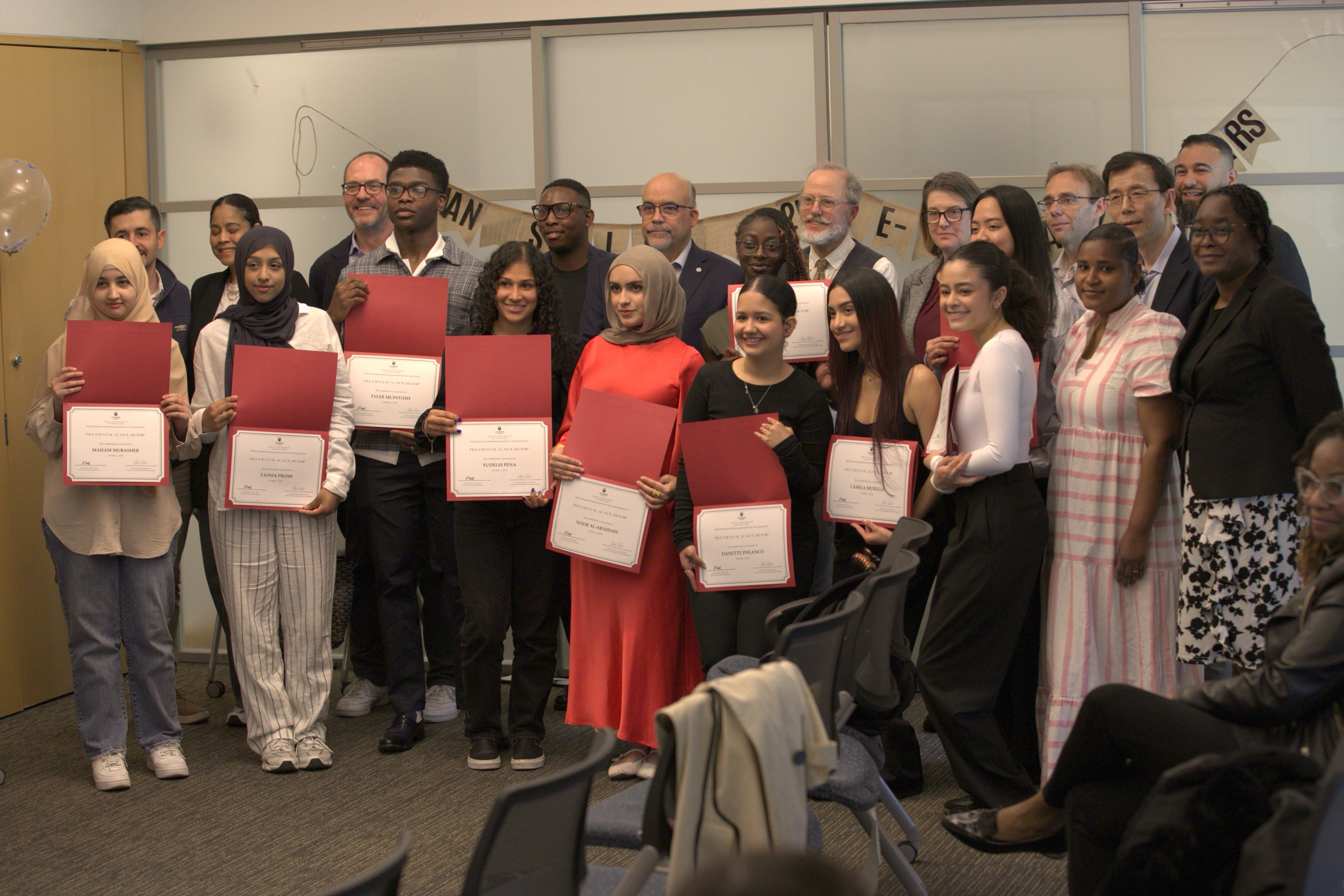 2025 SMILE Scholarship recipients pictured with faculty and staff.