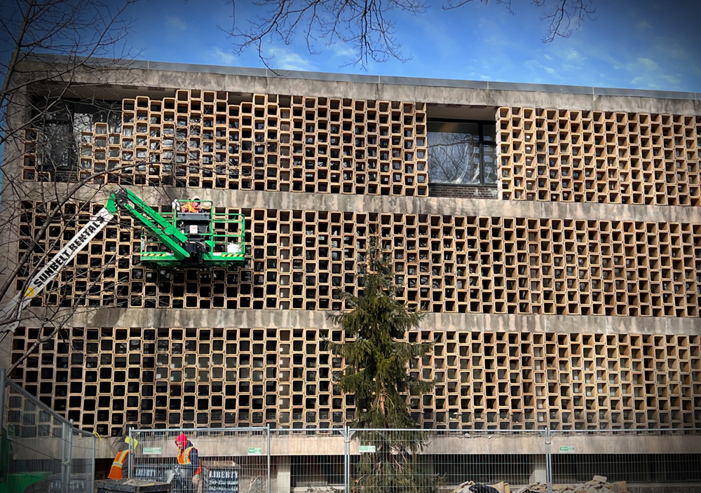 Portions of Shuster Hall's iconic honeycomb exterior designed by Marcel Breuer will be repaired as part of the Shuster refurbishment that will also include new windows. (Photo by Lisa Hirschfield)