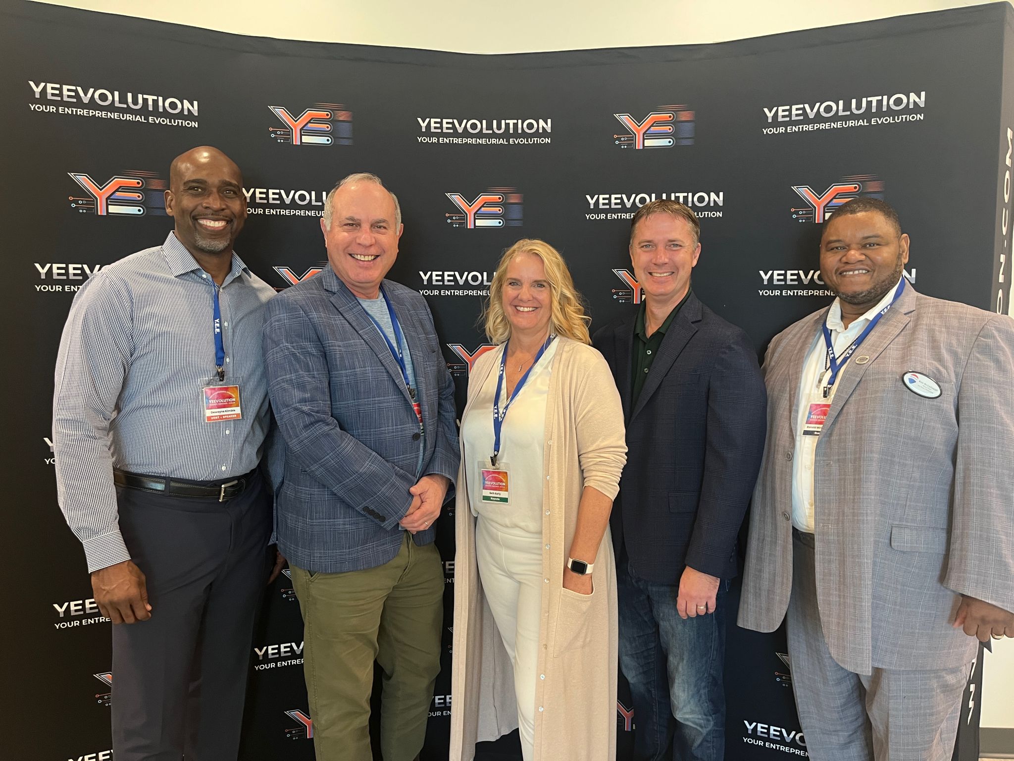 Andrew Gold, second from left, with former student DeWayne Kimball (left) and speakers at the YEEvolution conference (as seen on LinkedIn).