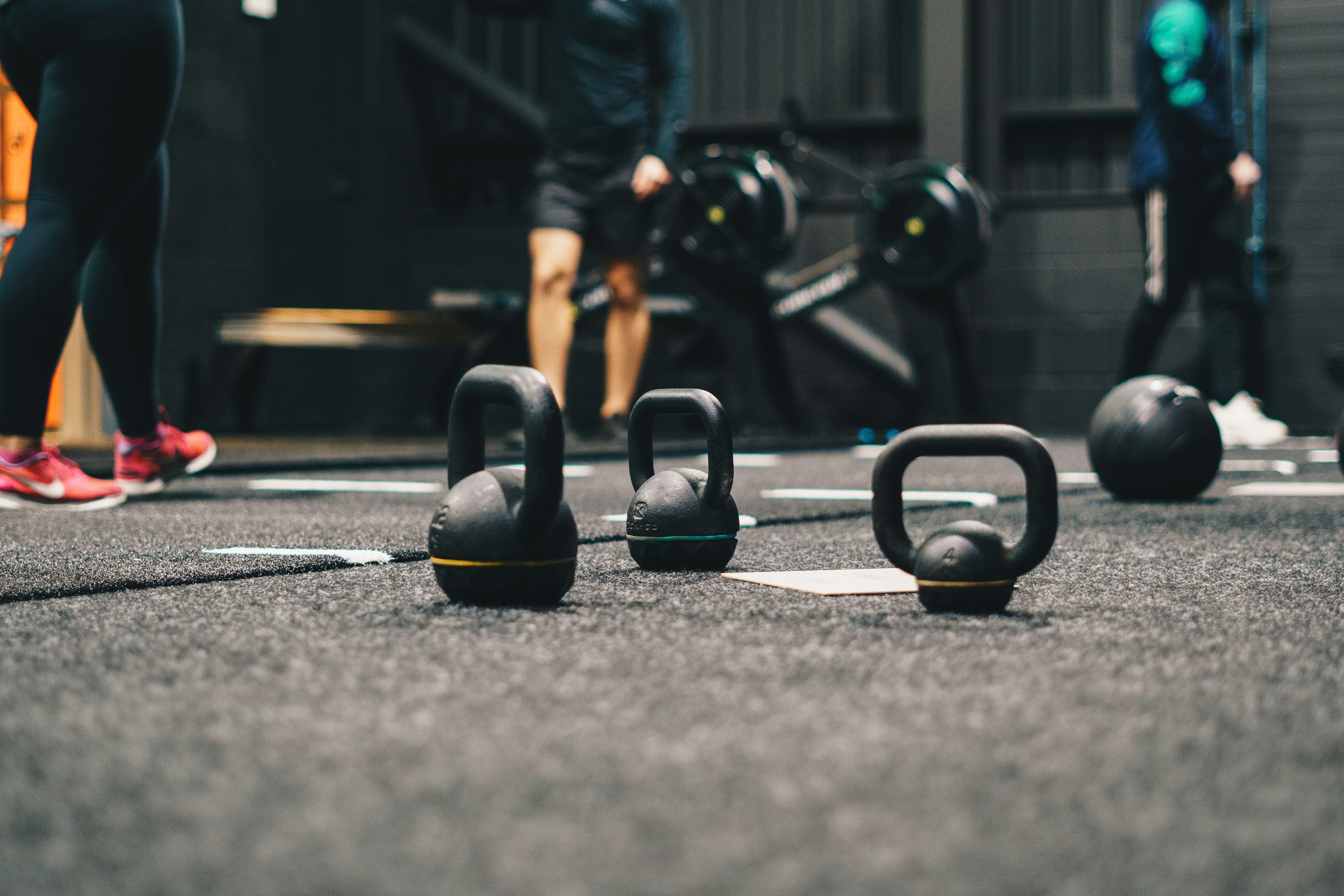 kettlebells on the floor of a gym