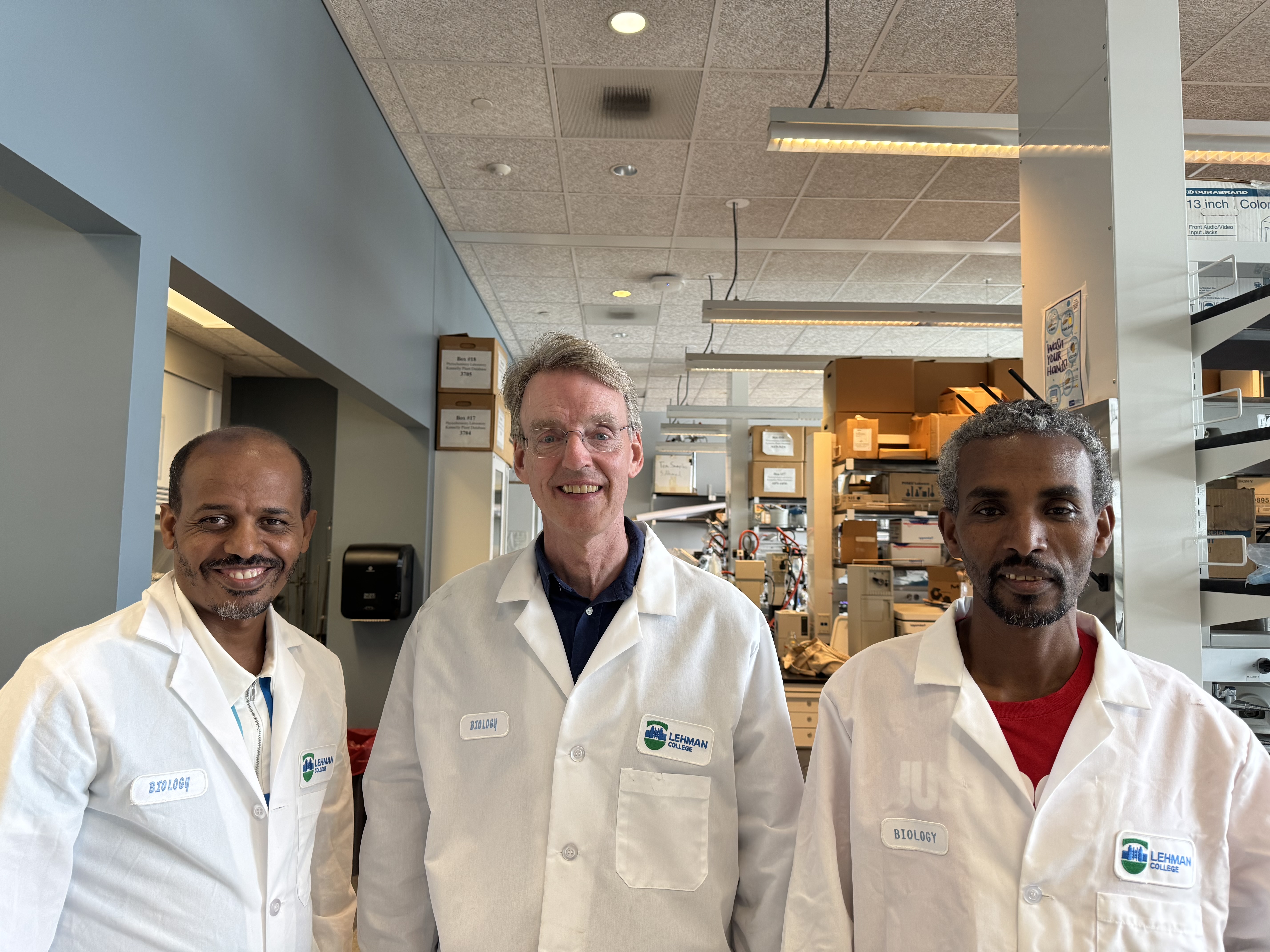 Professor Ed Kennelly Stands with Ethiopian scientists Endale Amare and Teshome Asseafa