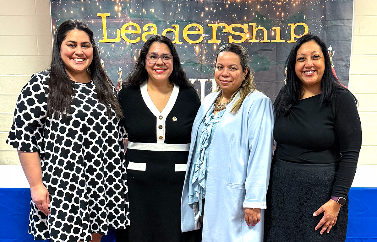 Beba Alvarado Torrech, alumna and Bronx Community Board 7 District Manager Karla Cabrera Carrera, Jasmin Clavasquin, and Suzette Ramsundar pose for a photo at Lehman