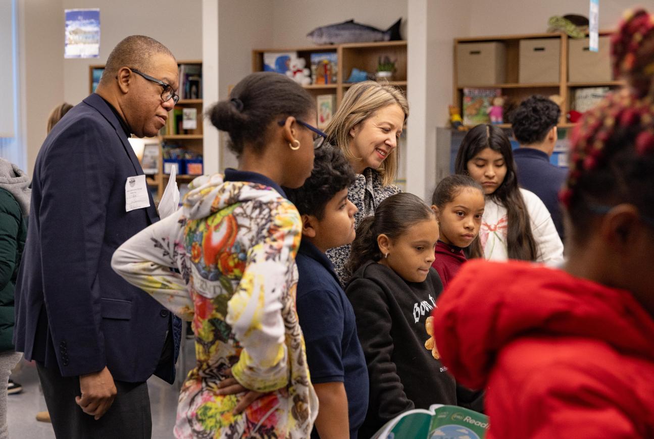 Photo of instructors with children in a classroom
