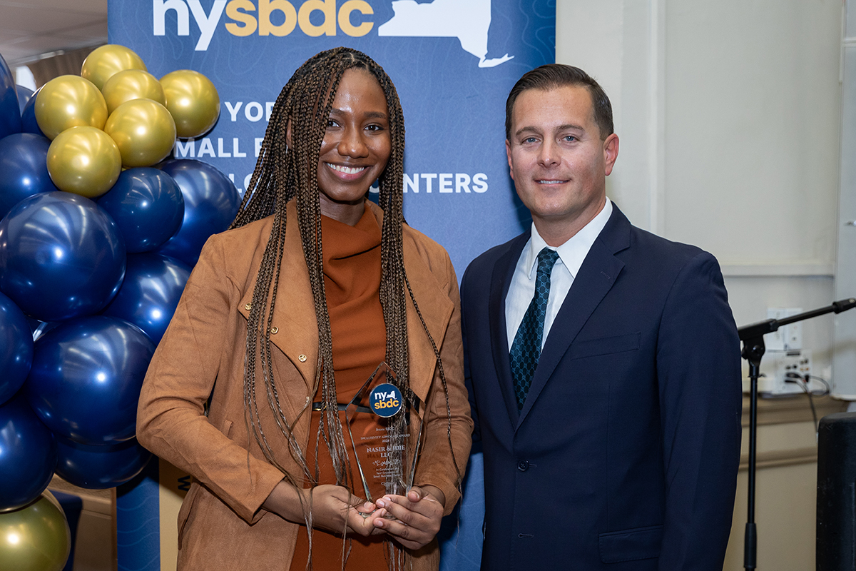 Photo of person receiving award at Small Business Development Center