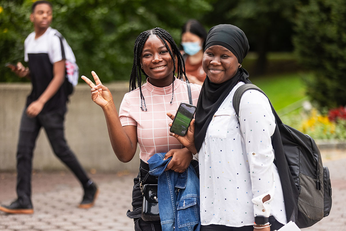 Photo of students smiling on campus