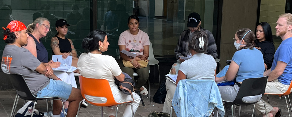 Students sitting on chairs in a circle