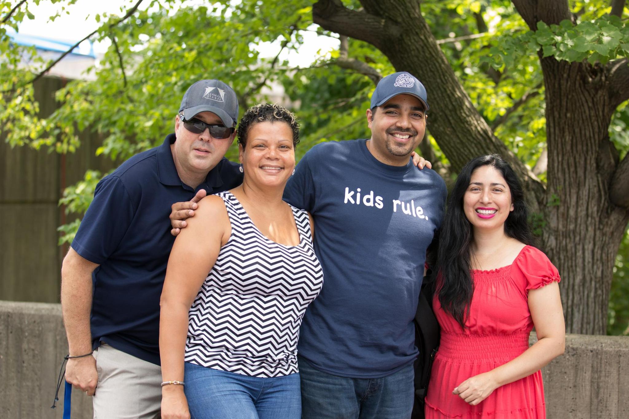 Group of people smiling at kids rule event