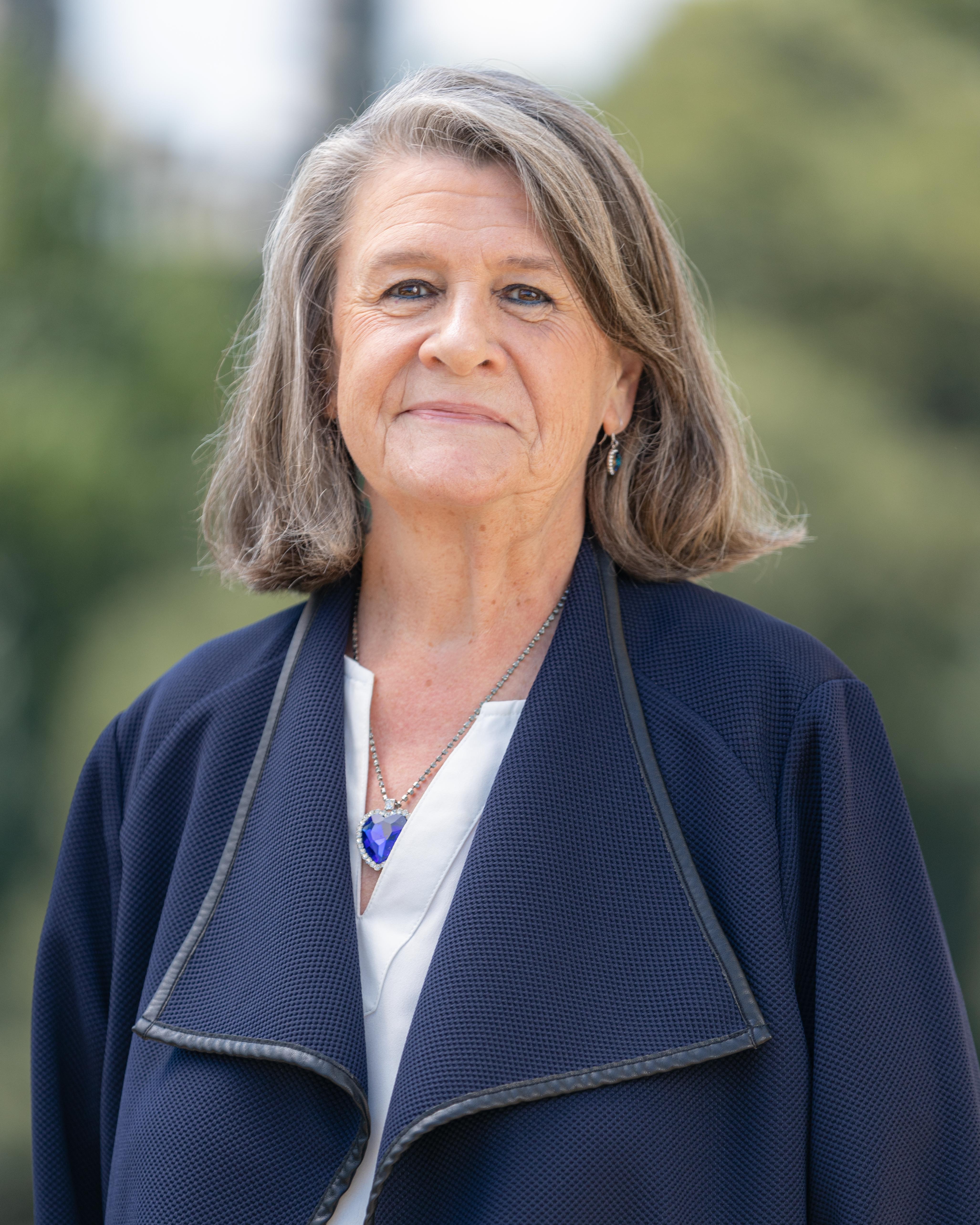 Karen Ellefsen white female wearing a blue sweater