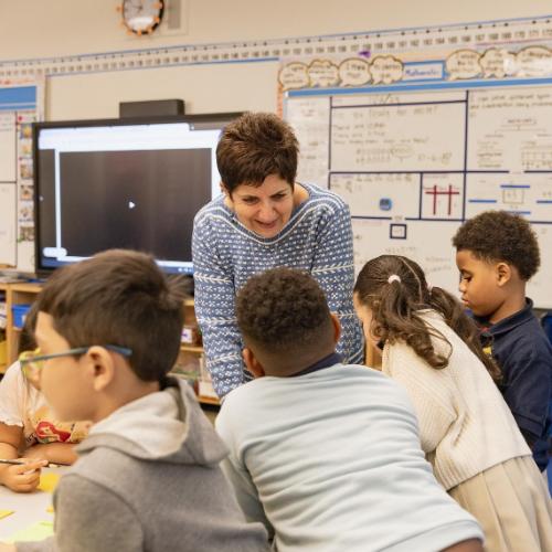 Teacher talking to students for LUTE Multi