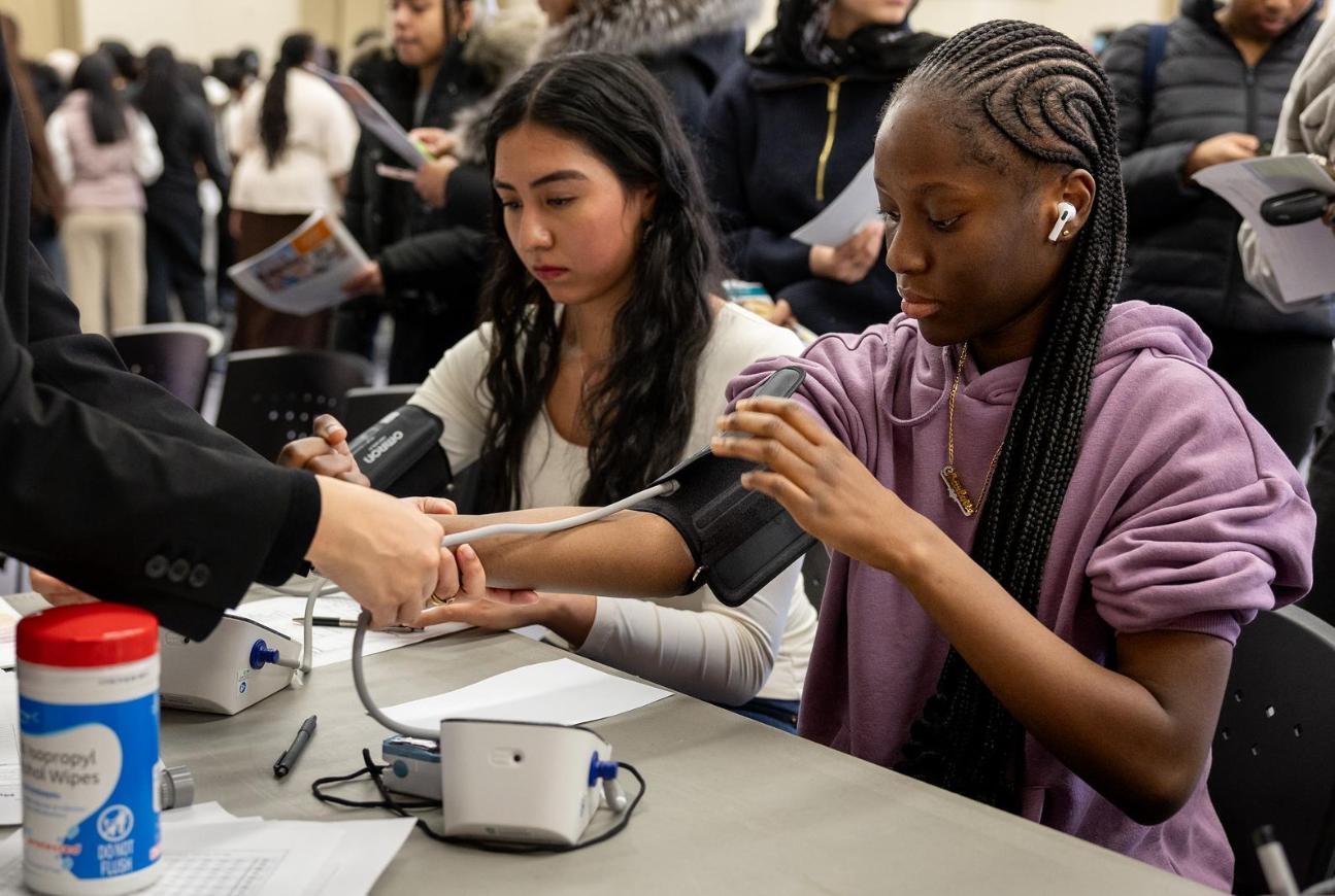 Students at a blood pressure workshop