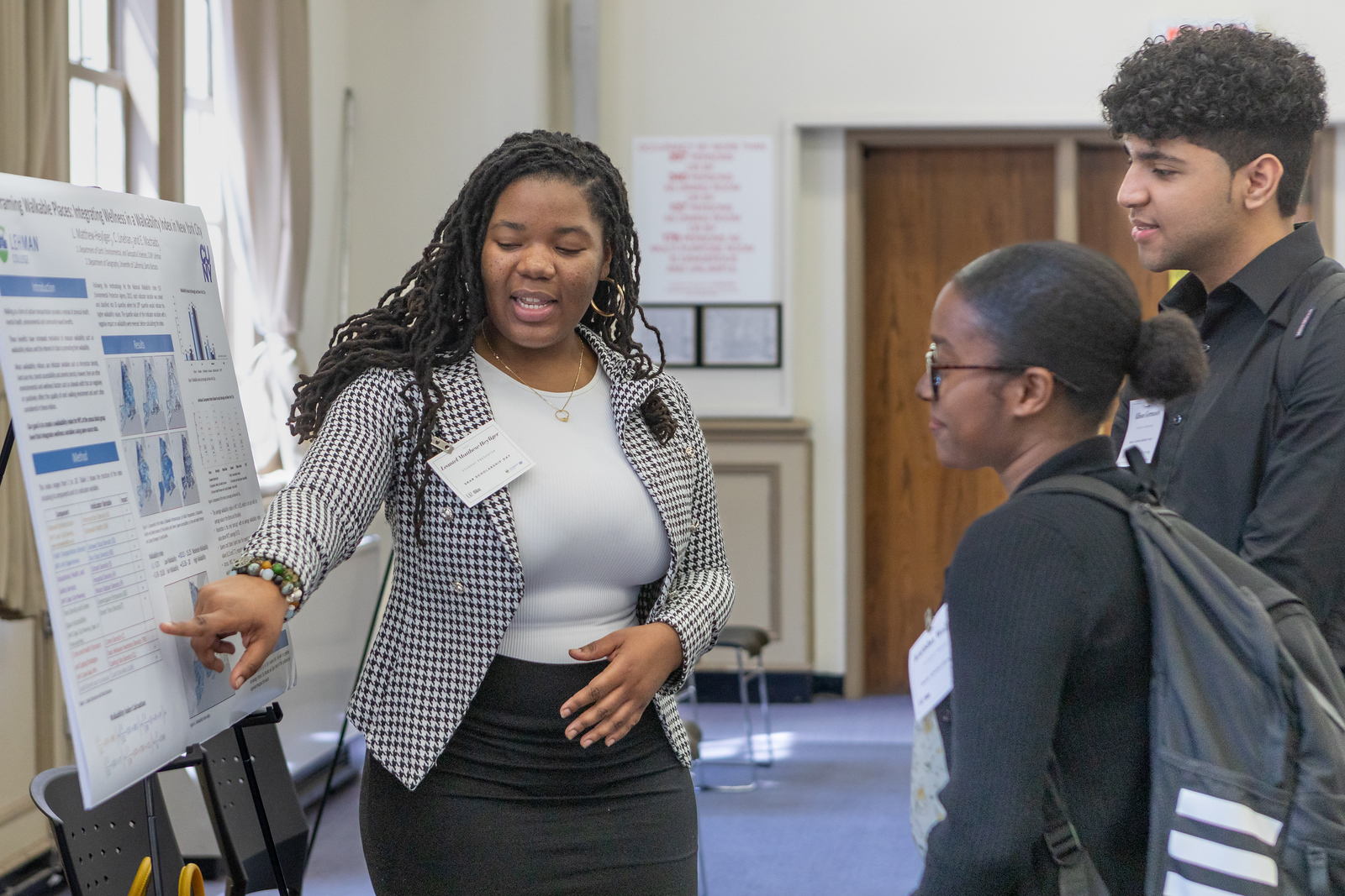 Student presenting their research at a scholarship event