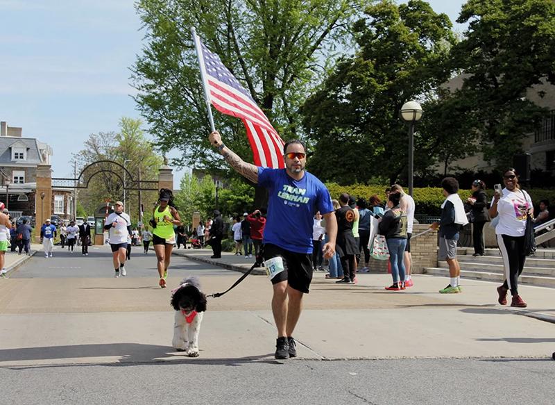 Photo of Luis Soltero and his dog running at marathon